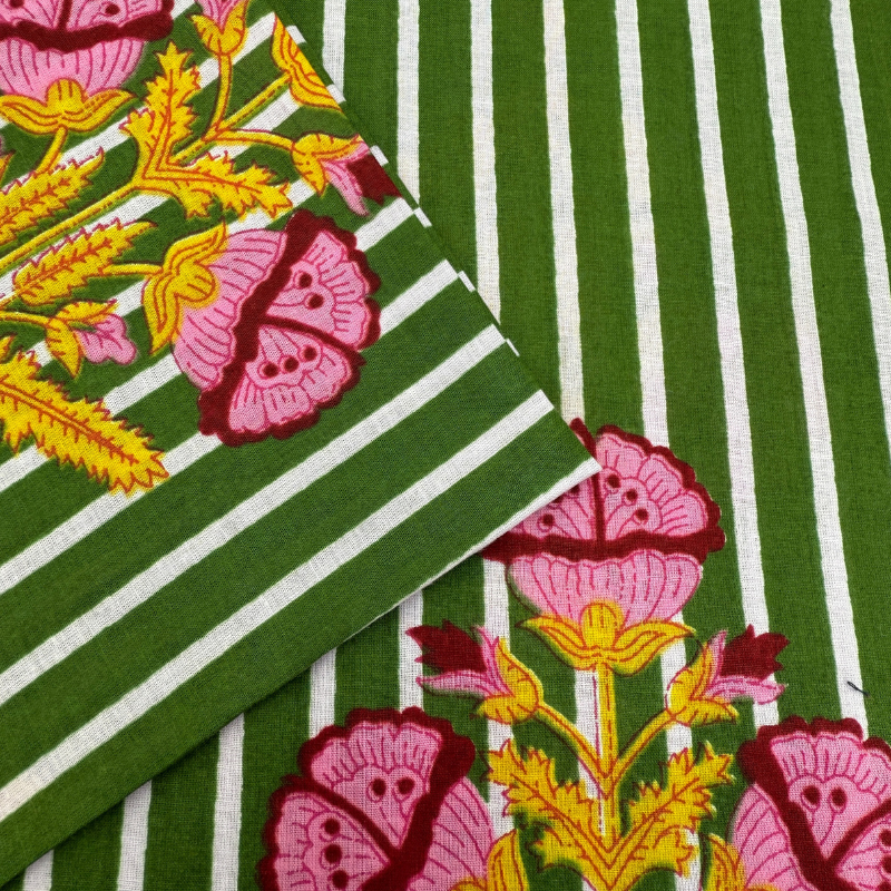 Green and white striped fabric with pink floral patterns