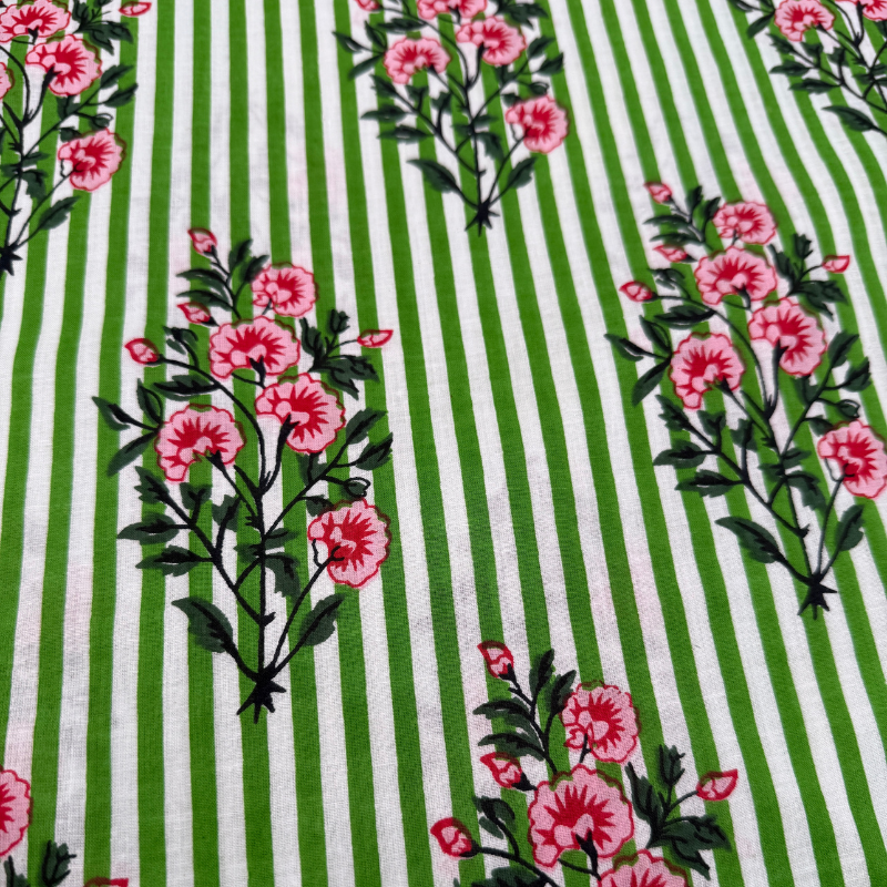 Cotton fabric with green and white stripes and pink floral patterns