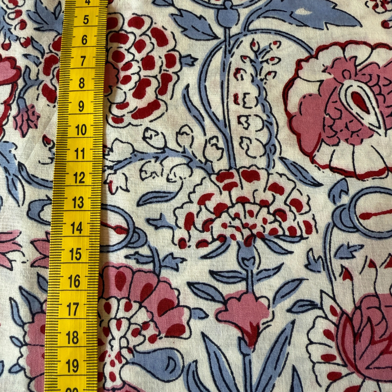 Floral fabric pattern with a yellow measuring tape on the left side