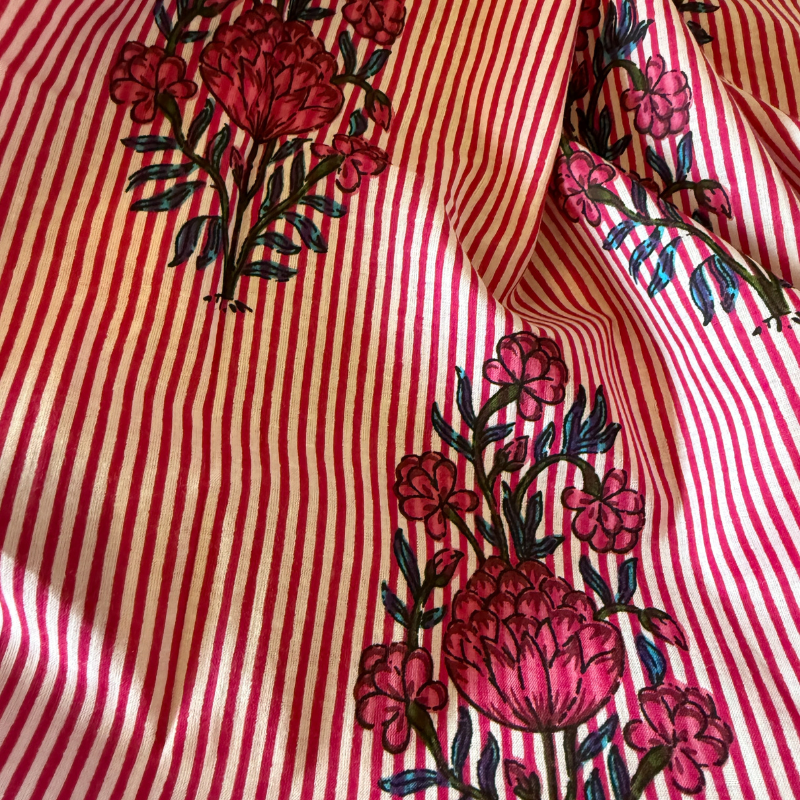 Red and white striped fabric with floral patterns