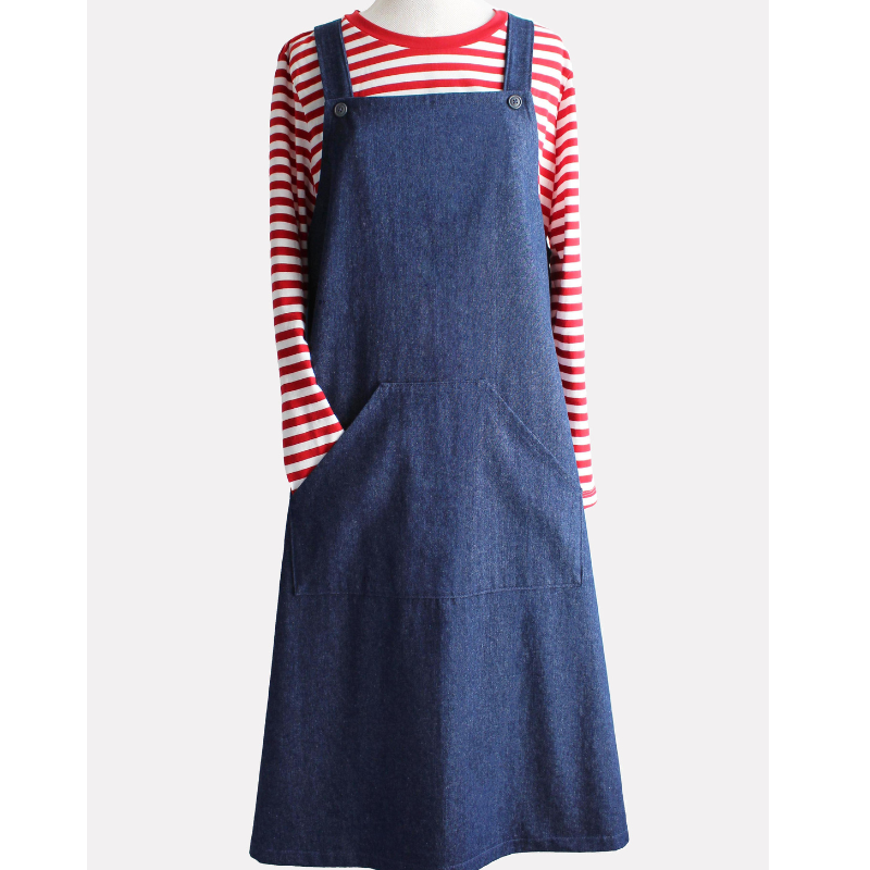 Blue denim pinafore dress over a red and white striped shirt on a white background