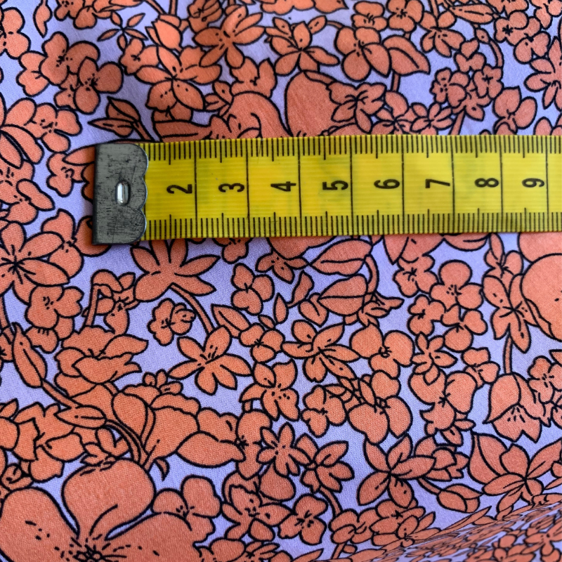 Flora cotton fabric tangerine with measure tape