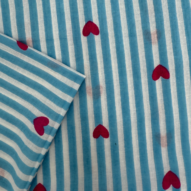 Blue and white striped fabric with pink hearts
