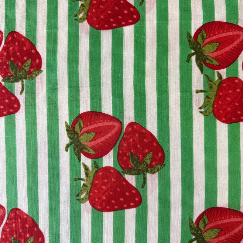Fabric with red strawberries and green stripes