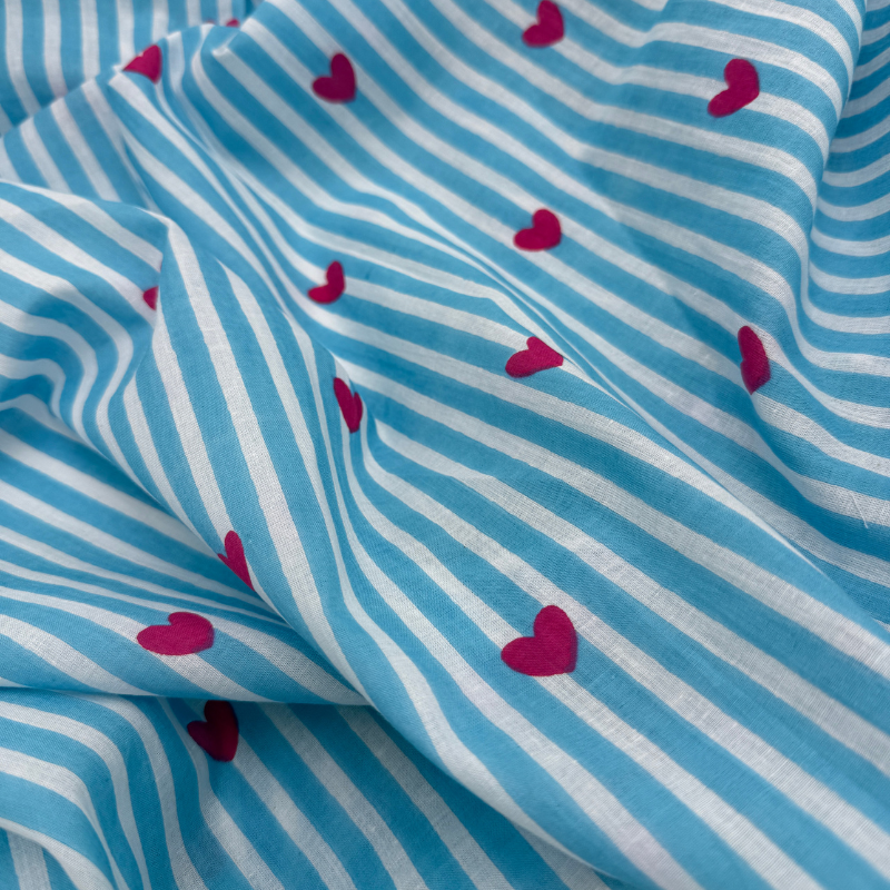Fabric with blue and white stripes and pink hearts