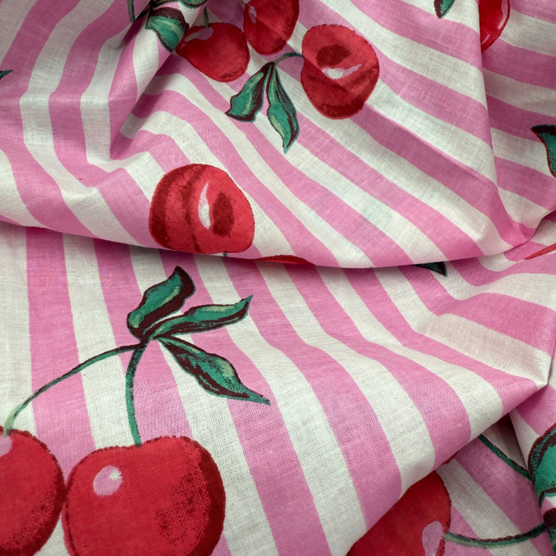 Fabric with pink and white stripes and red cherries