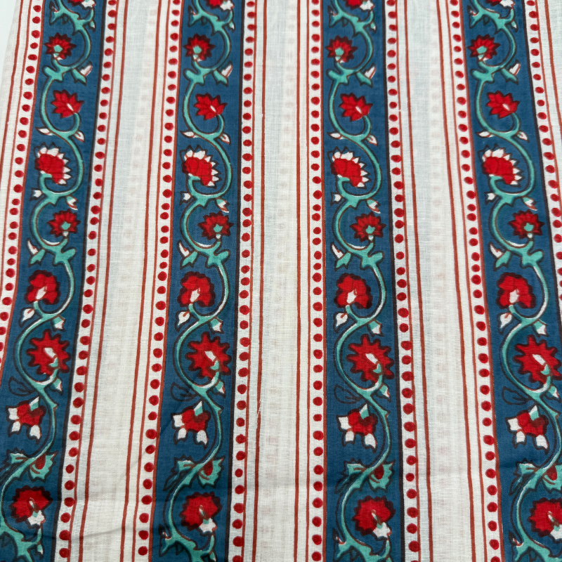 Fabric with red floral patterns on blue and white stripes