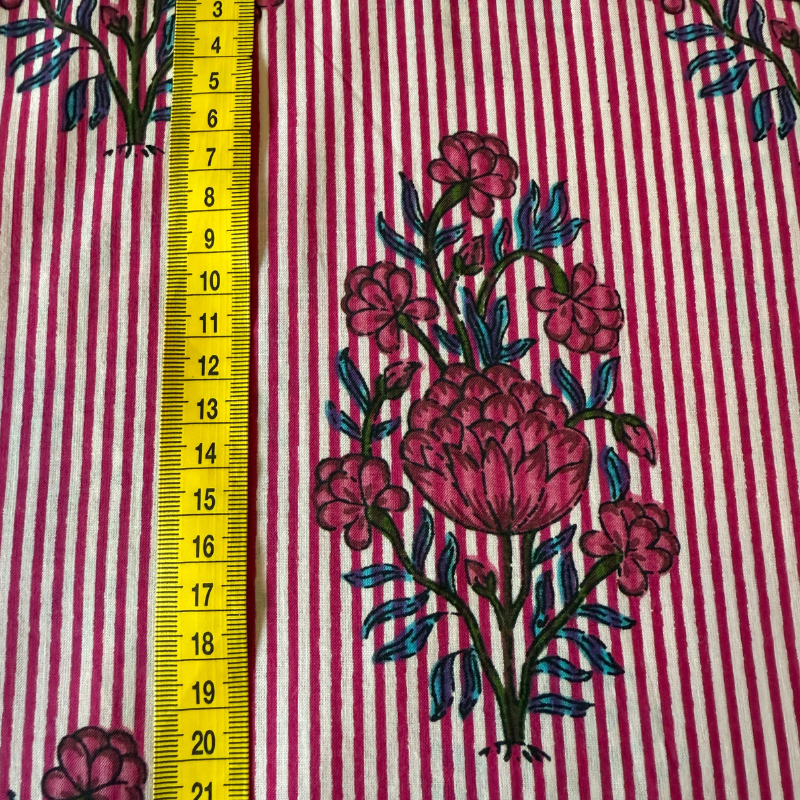 Floral on fabric with a yellow measuring tape