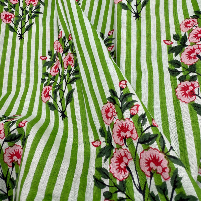 Fabric with green and white stripes and pink floral patterns