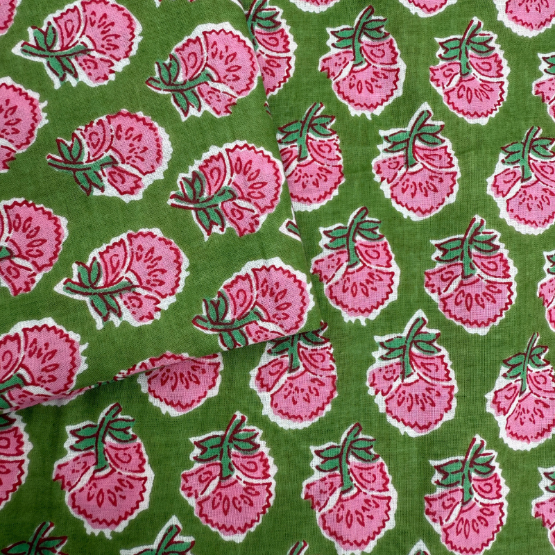 Pattern of pink flowers with green leaves on a green background