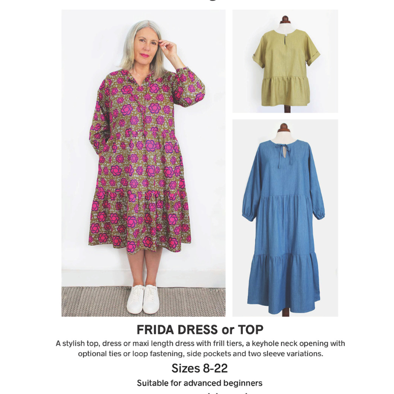 Woman wearing a floral dress with two other dresses displayed on mannequins against a white background.