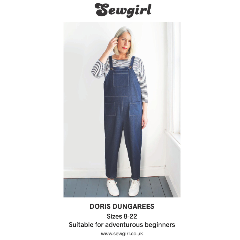 Woman wearing blue dungarees with 'Sewgirl' branding on a white background