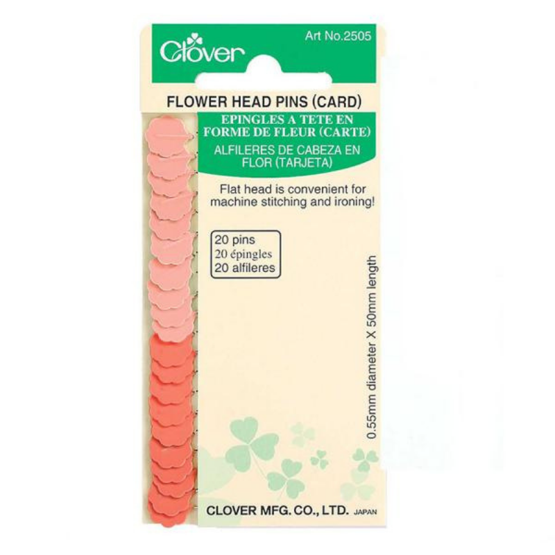 Packaging of Clover Flower Head Pins displaying multiple pins with flat heads, for sewing purposes.